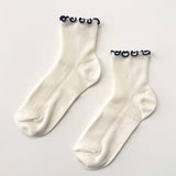 The Petite Ruffled Modal Socks (Soft White/Navy)